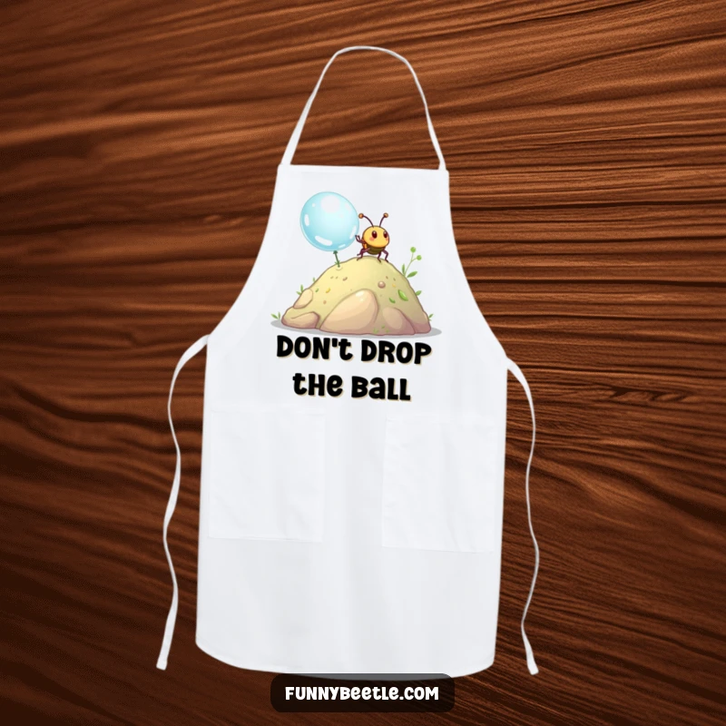 Funny beetle apron showing a happy beetle pushing a giant dewdrop uphill, a humorous kitchen accessory for cooking and baking.