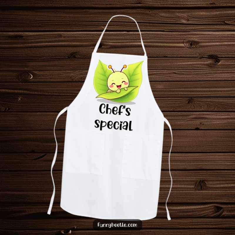 Funny apron with a cheerful caterpillar munching on a green leaf, designed for kitchen fun and protection with a humorous, foodie flair.